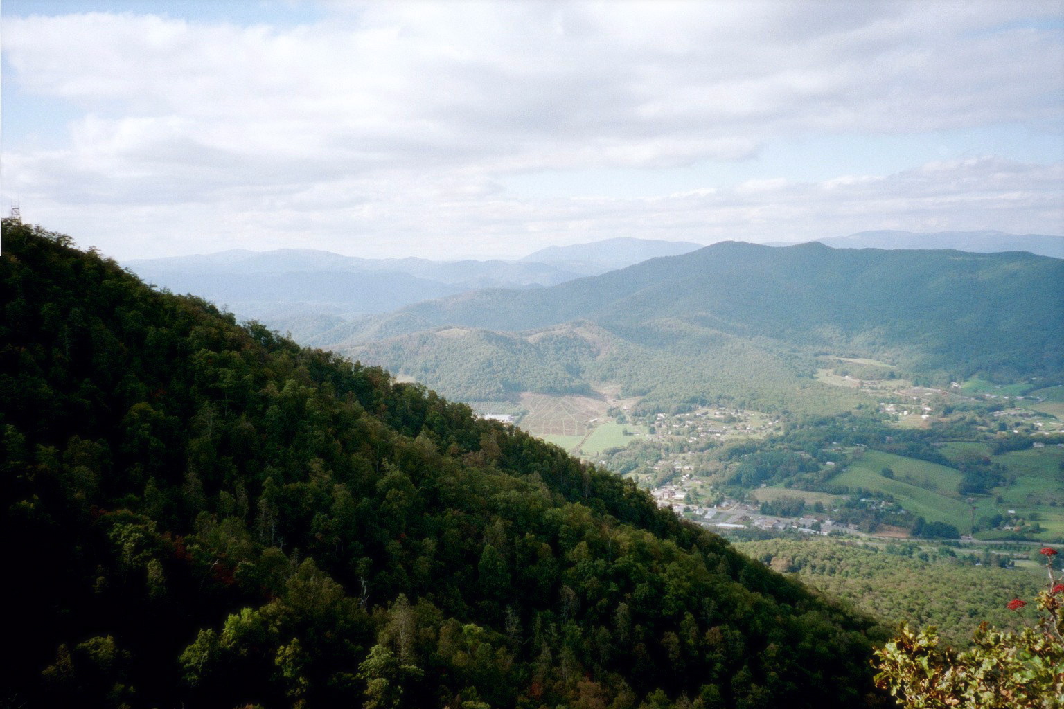 Small mountain community nestled between forested ridgelines in the NC High Country